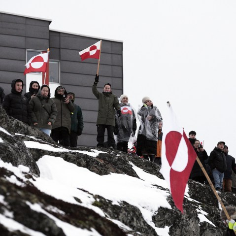 People wave Greenlandic flags as they take part in a demonstration on Jan. 17, 2026 to protest against the US President's plans to take Greenland in Nuuk.