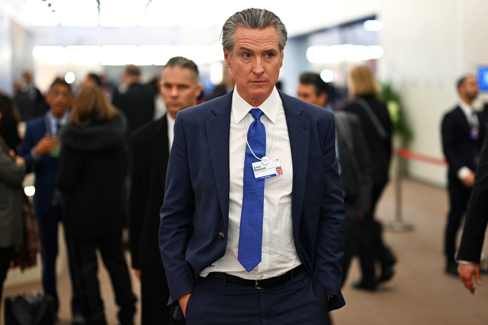 Gavin Newsom walks down a hallway during the World Economic Forum in Davos, Switzerland.