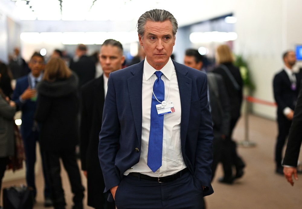 Gavin Newsom walks down a hallway during the World Economic Forum in Davos, Switzerland.